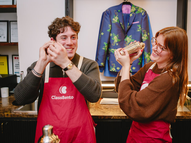 People shaking cocktails